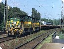 [DE 404 und eine weitere DE G1206 durchfahren Castrop-Rauxel Hbf. mit leeren Coilwagen]